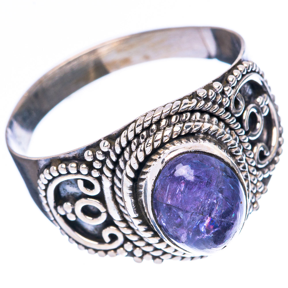 Sterling silver ring with oval purple gemstone and detailed scrollwork design