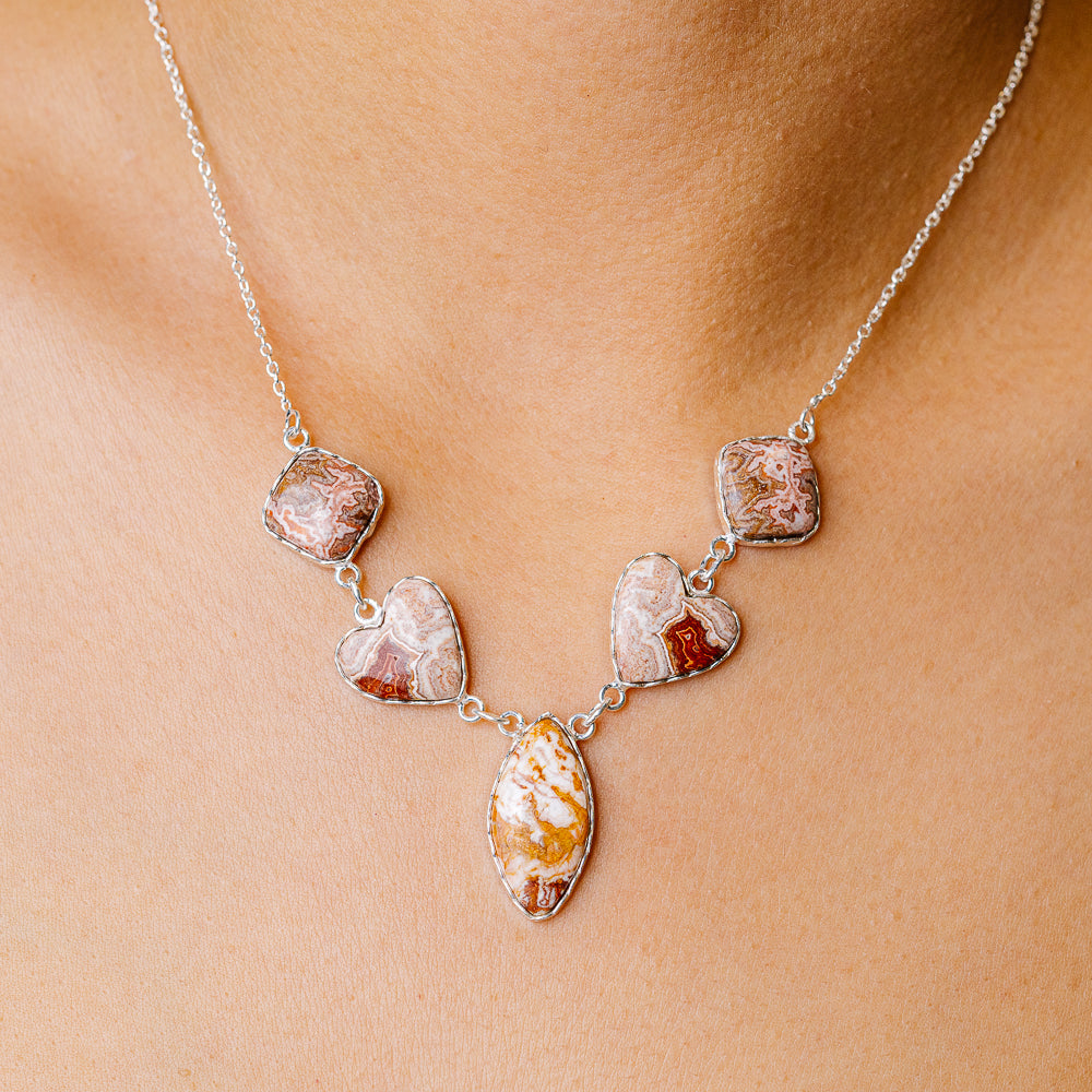 Crazy lace agate heart necklace with 925 silver chain and five linked heart pendants
