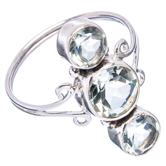 Sterling silver ring with curved band and three round faceted gemstones