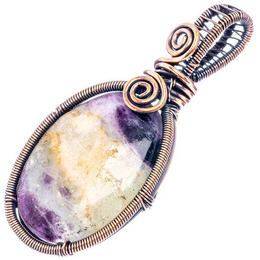 Wire-wrapped teardrop pendant with purple stone and oxidized copper spiral wrap, angled
