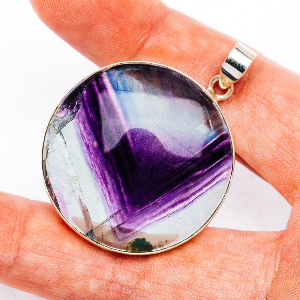Round fluorite pendant, purple-and-white stone set in .925 sterling silver bezel