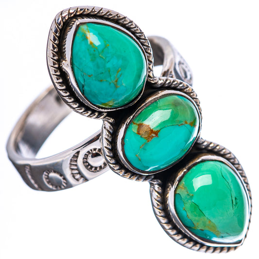 Sterling silver turquoise ring featuring three oval cabochon stones in ornate settings
