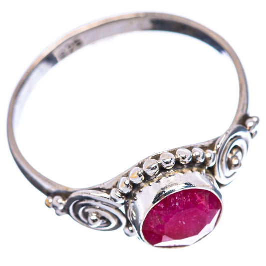 Sterling silver ring with round red gemstone bezel and swirling band, size 7
