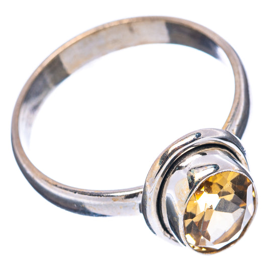 Sterling silver citrine ring featuring a large faceted yellow center stone in bezel