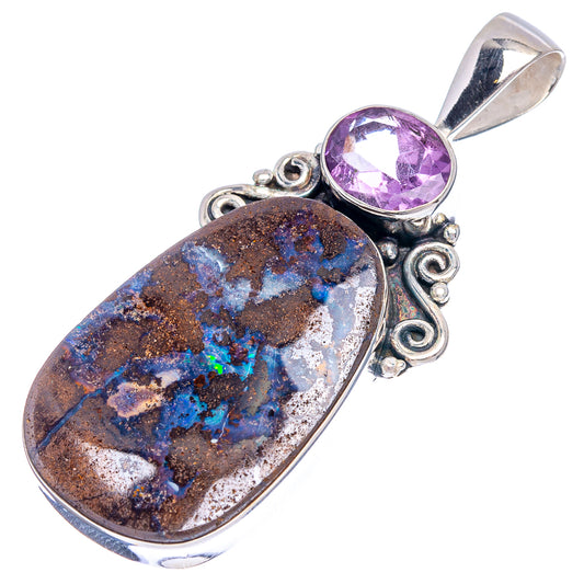 Sterling silver pendant with oval amethyst and boulder opal cabochons, scroll-style frame