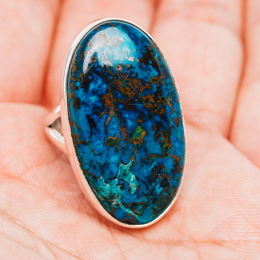 Oval blue shattuckite cabochon ring with sterling silver bezel