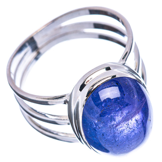 Polished sterling silver ring with round-oval blue tanzanite cabochon centerpiece