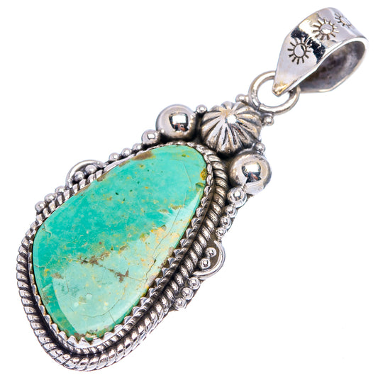 Turquoise teardrop pendant with engraved .925 sterling silver border and loop bail