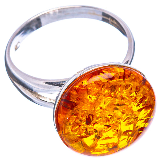 Yellow-orange amber cabochon ring with round stone set on sterling silver band