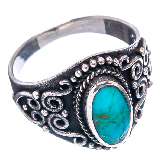 Turquoise oval cabochon ring, dark filigree band with raised silver bezel