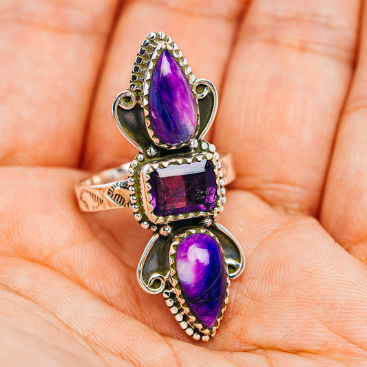 Silver ring with three stacked purple stones, rope-edge bezels, and openwork details
