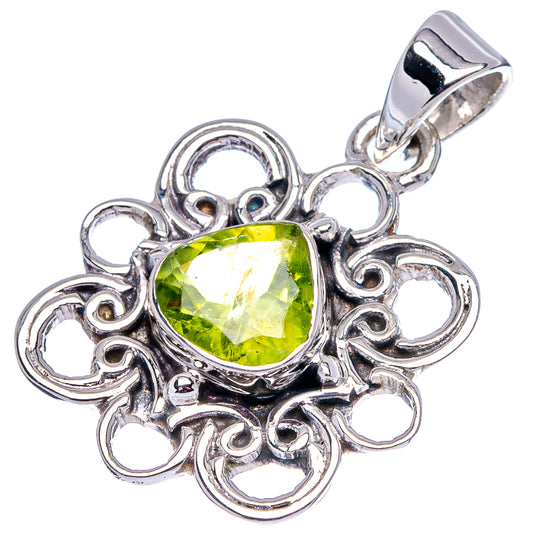 Sterling silver peridot pendant, green gemstone in decorative heart-like scroll frame
