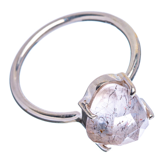 Open-top sterling silver ring with prong-set faceted pink stone, heart bezel