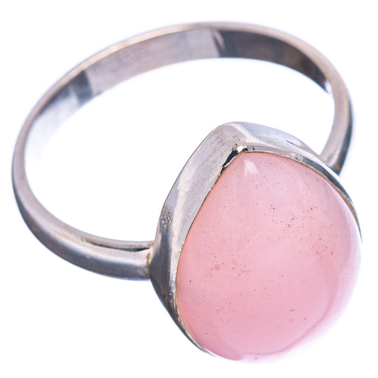 Sterling silver ring with rounded pink opal cabochon, side view, bezel-set