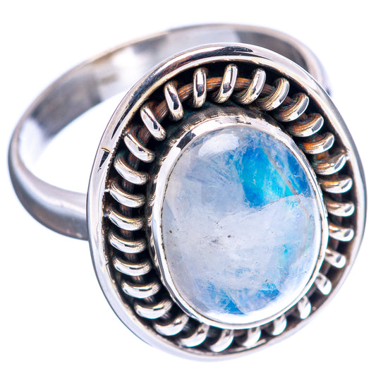 Sterling silver oval moonstone ring with blue cabochon and scalloped side bezel