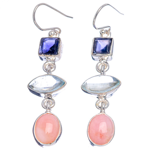 Sterling silver earrings with dark blue square stones, iridescent oval, and pink teardrops