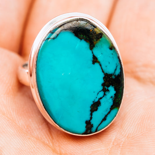 Sterling silver ring with large oval turquoise cabochon and black matrix veins