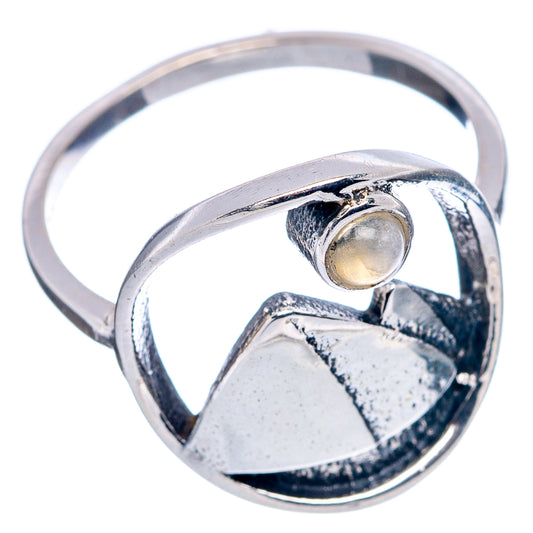 Dainty .925 sterling silver moonstone ring, side view with oval cabochon and mountain bezel
