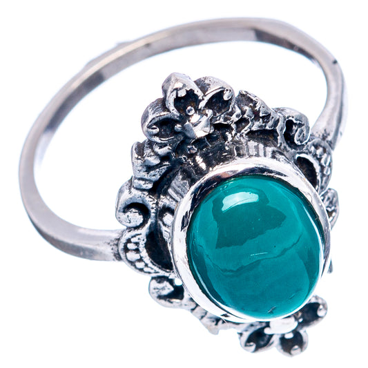 Sterling silver ring with oval green onyx set in ornate leaf-like side setting