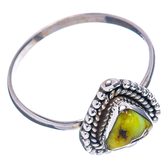 Sterling silver ring with teardrop green-yellow stone, beaded halo, and thin band