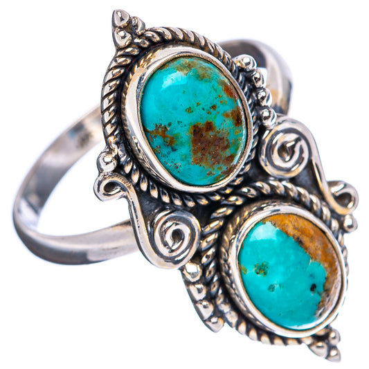 Sterling silver adjustable ring with two oval turquoise cabochons and detailed scroll settings