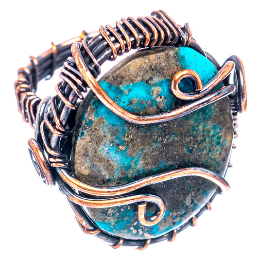 Turquoise wire wrap ring with oval stone, copper wire loops and dark metal prongs