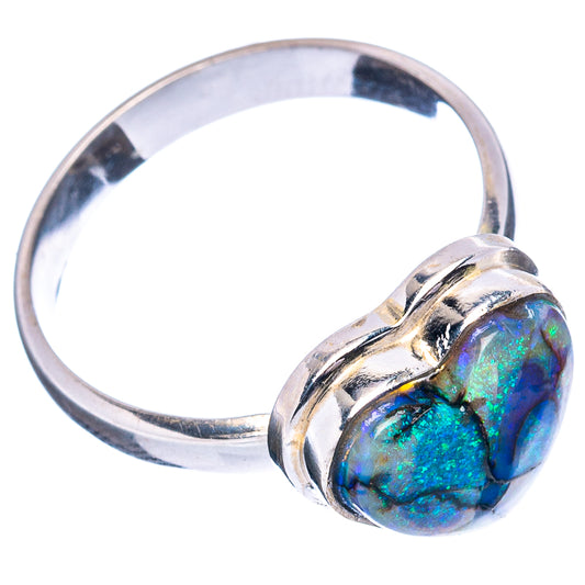 Sterling silver heart ring featuring blue-green iridescent opal, side angle