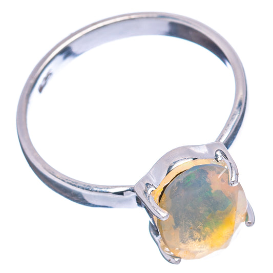 Sterling silver opal ring with oval yellow-green opal and four-prong setting