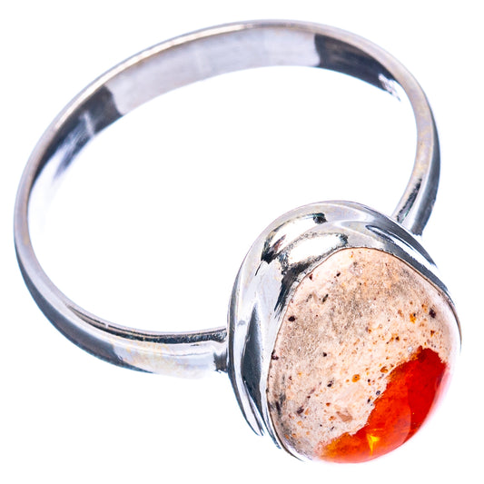 Sterling silver ring with oval fire opal, orange-red stone in bezel setting