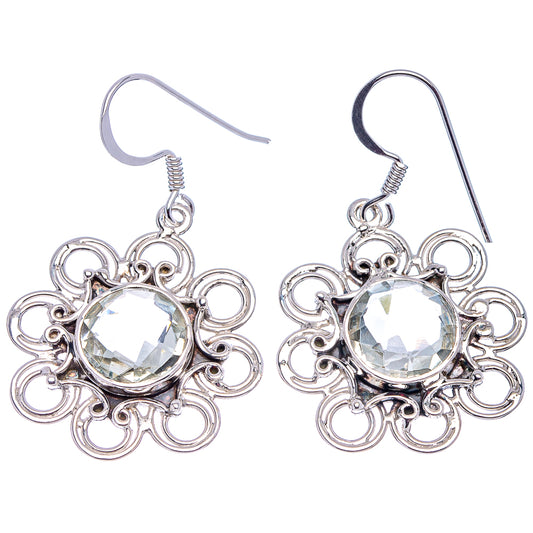 Sterling silver drop earrings with round faceted clear gemstone and flower-like filigree