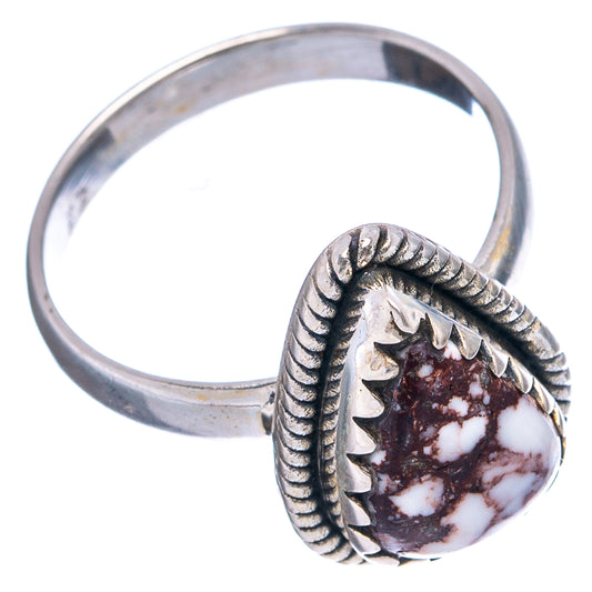 Sterling silver ring with ornate bezel and marbled white/dark red teardrop cabochon
