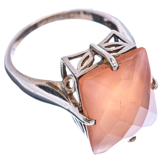 Sterling silver ring with large peach faceted gemstone and openwork claw setting