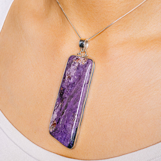 Purple charoite pendant with .925 sterling silver bezel, on a silver chain