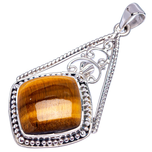Sterling silver tiger's eye pendant with square amber-gold cabochon and decorative frame