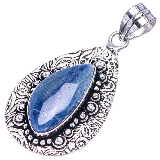 German silver teardrop pendant with embossed swirl design and oval blue gemstone