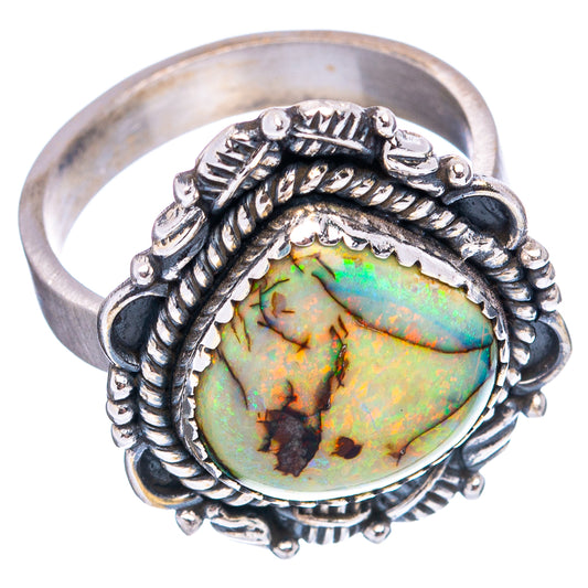 Sterling silver opal ring, oval iridescent opal in detailed rope-style frame