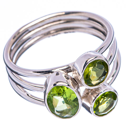 Sterling silver ring with three round green peridot stones and stacked band, side view