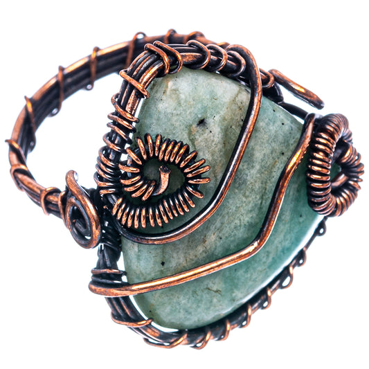Oxidized copper wire wrap ring with oval green-blue stone and sunburst detail
