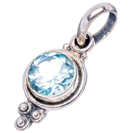 Round blue topaz pendant, 7/8" sterling silver with curled ornate side details