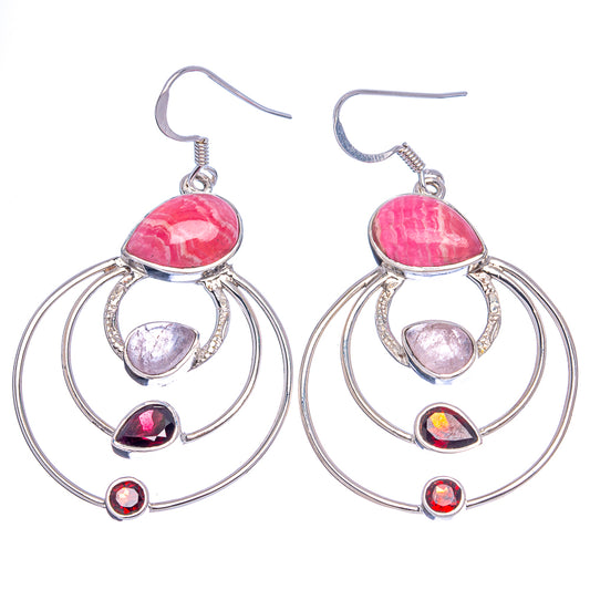 Pair of sterling silver hoop earrings with pink top cabochon and red accents