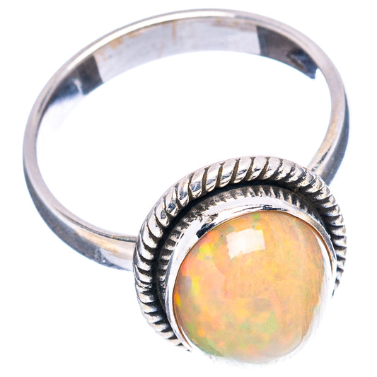 Sterling silver opal oval ring with rope-style bezel and iridescent orange-yellow stone