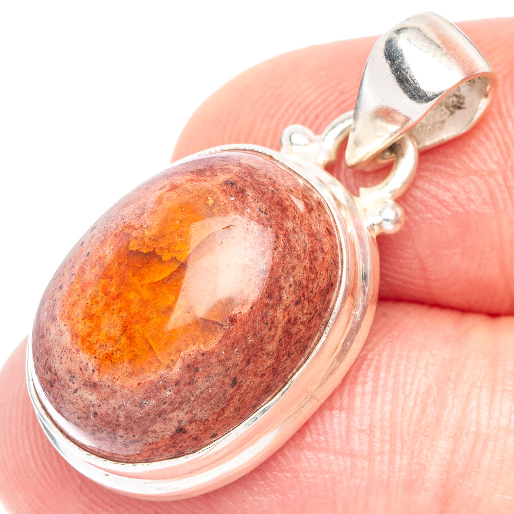 Oval fire opal pendant with orange-red stone bezel in sterling silver