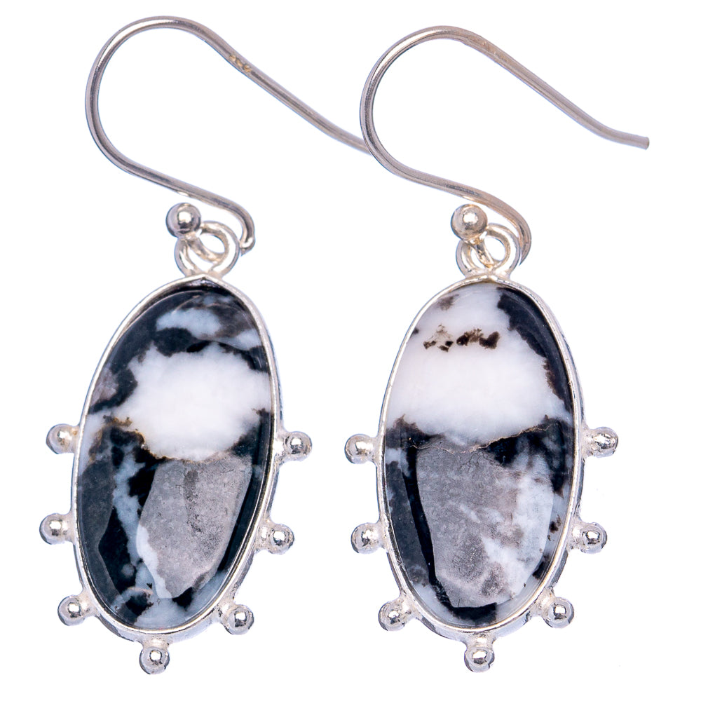 Sterling silver oval drop earrings with black-and-white stone and beaded halo, hook backs