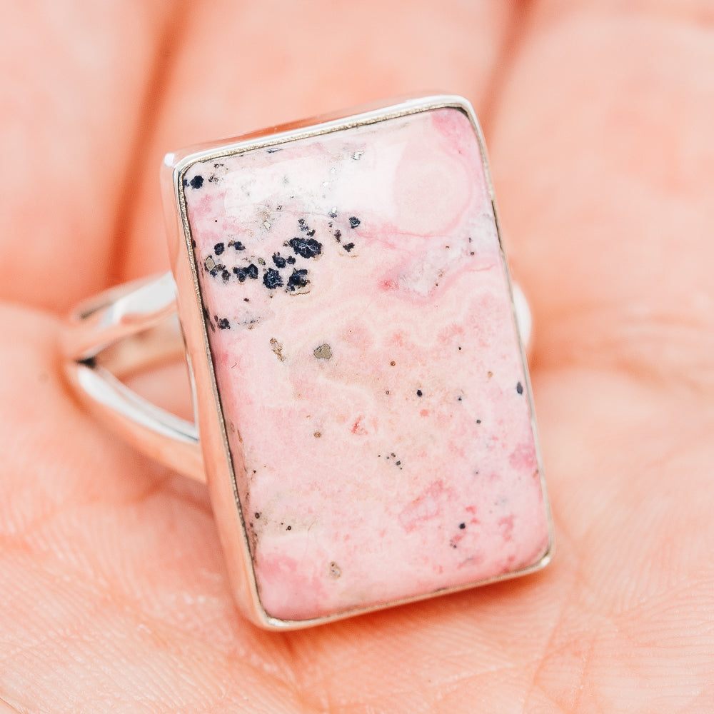 Rectangle pink rhodonite ring with silver prong/side profile and speckled stone face