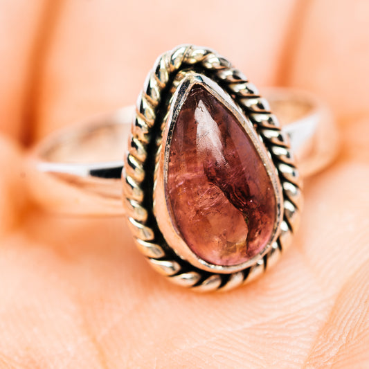 Sterling silver tourmaline ring, oval red-pink gem with rope sides and border