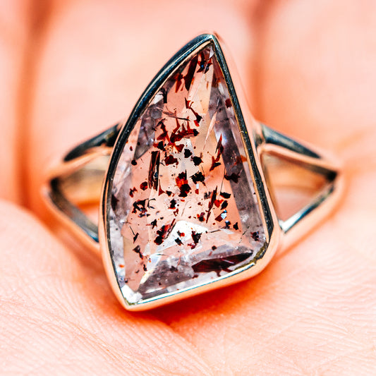 Sterling silver ring with faceted teardrop gemstone, orange and smoky black speckled look