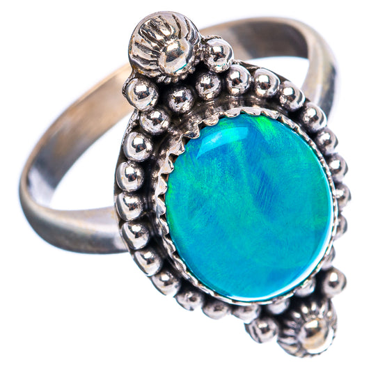 Sterling silver opal ring with oval blue-green gemstone in beaded border