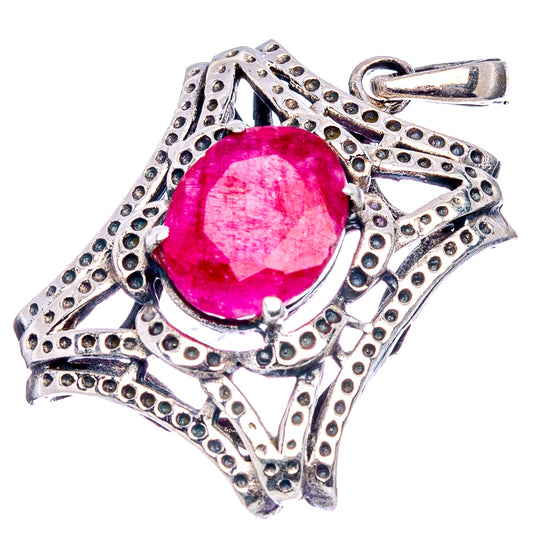 Oval red gemstone pendant with ornate sterling silver filigree and top loop bail