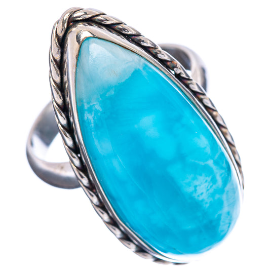 Larimar ring with oval blue stone, braided silver setting, and smooth band