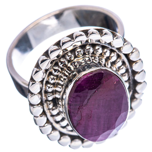 Sterling silver ruby cabochon ring with raised oval bezel and textured beaded band